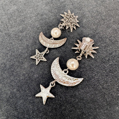 Silver-tone star and moon drop earrings with pearl beads and crystal pavé details