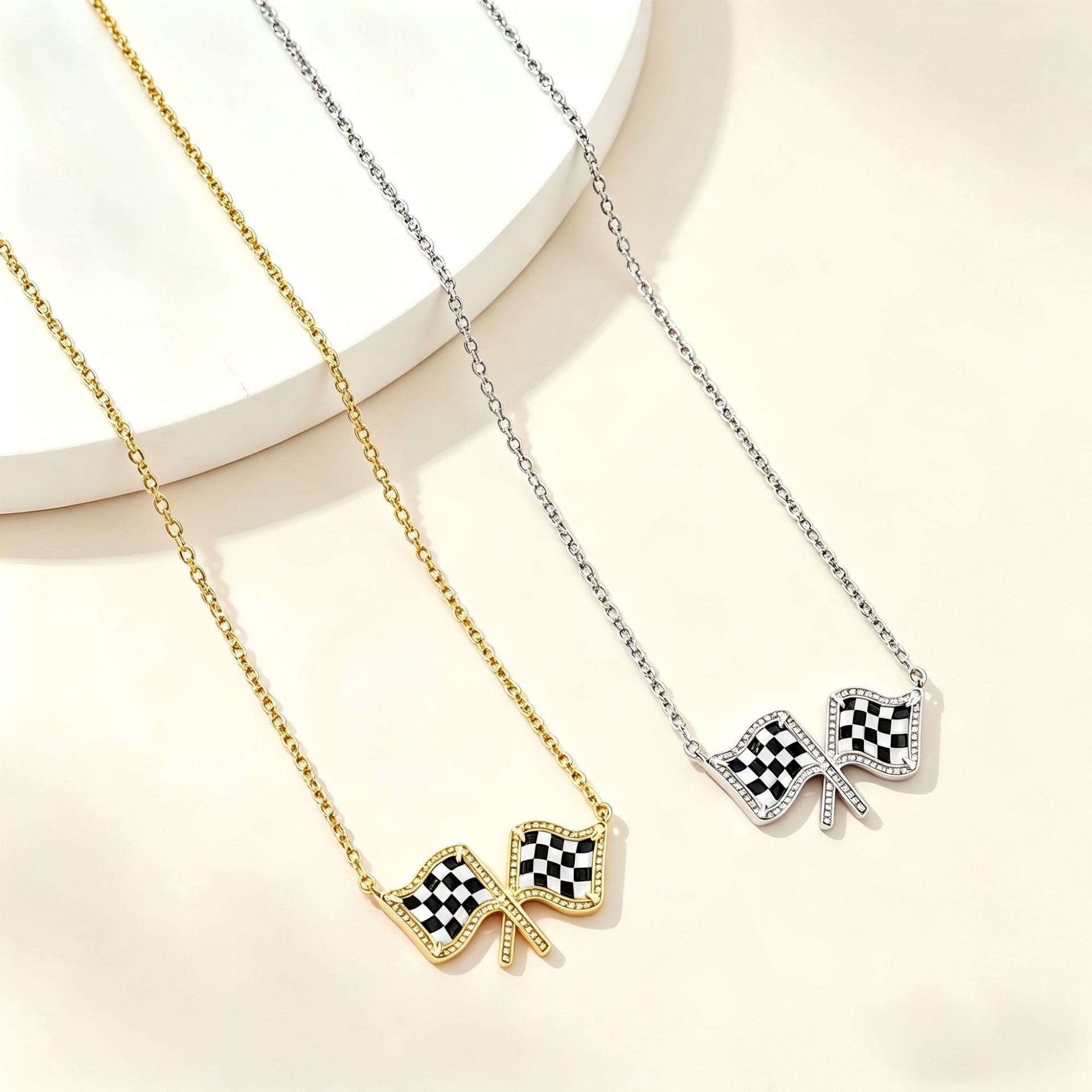 Gold chain necklace with two checkered flag bow pendants