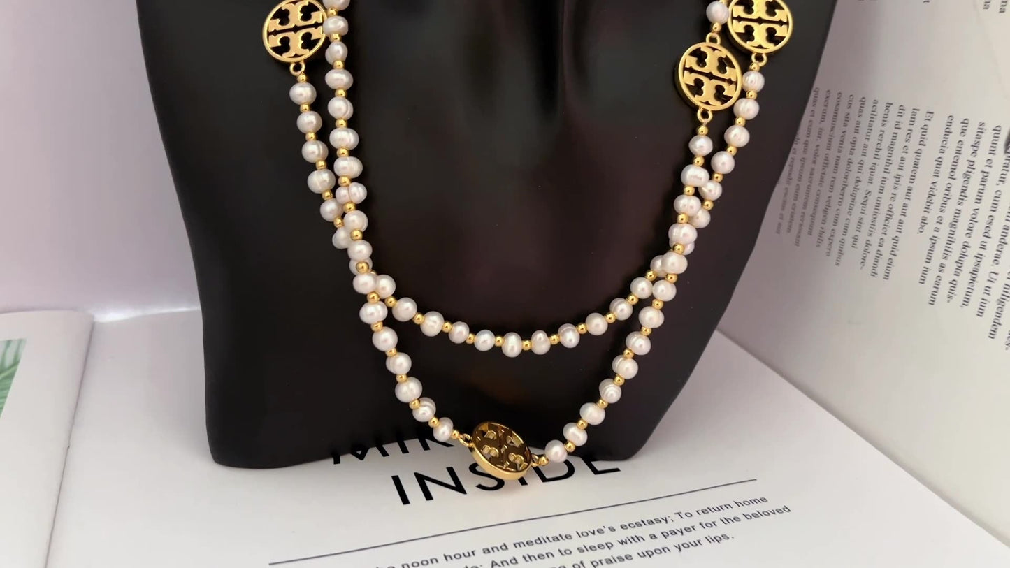 Tory Burch round hollow letter pearl sweater necklace