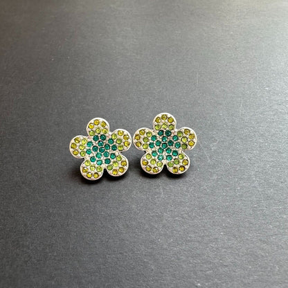 Gold-tone floral stud earrings with green and teal rhinestones
