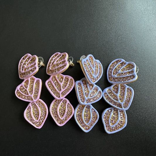 Gold-plated leaf pendant earrings with lavender enamel hearts and crystal shimmer