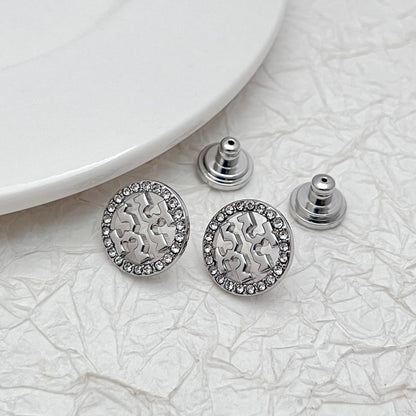 Tory Burch logo stud earrings, silver-tone round discs with openwork pattern and rhinestone rim