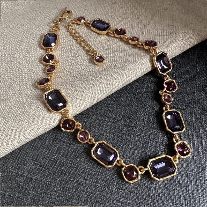 Square crystal pendant necklace with dark purple faceted stones on gold-toned chain