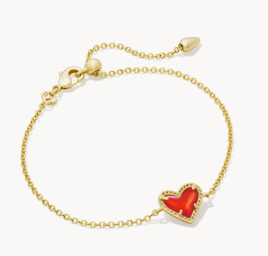 Adjustable heart charm bracelet with gold-tone chain and red crystal heart pendant with sparkle.