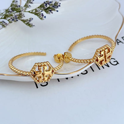 Tory Burch C-shaped hollow metal earrings for women