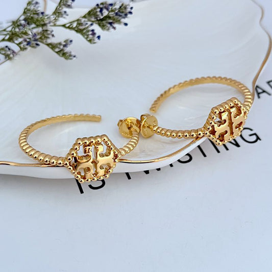 Tory Burch C-shaped hollow metal earrings for women