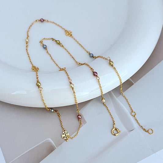 Gold-tone chain bracelets with freshwater pearls and logo charm details
