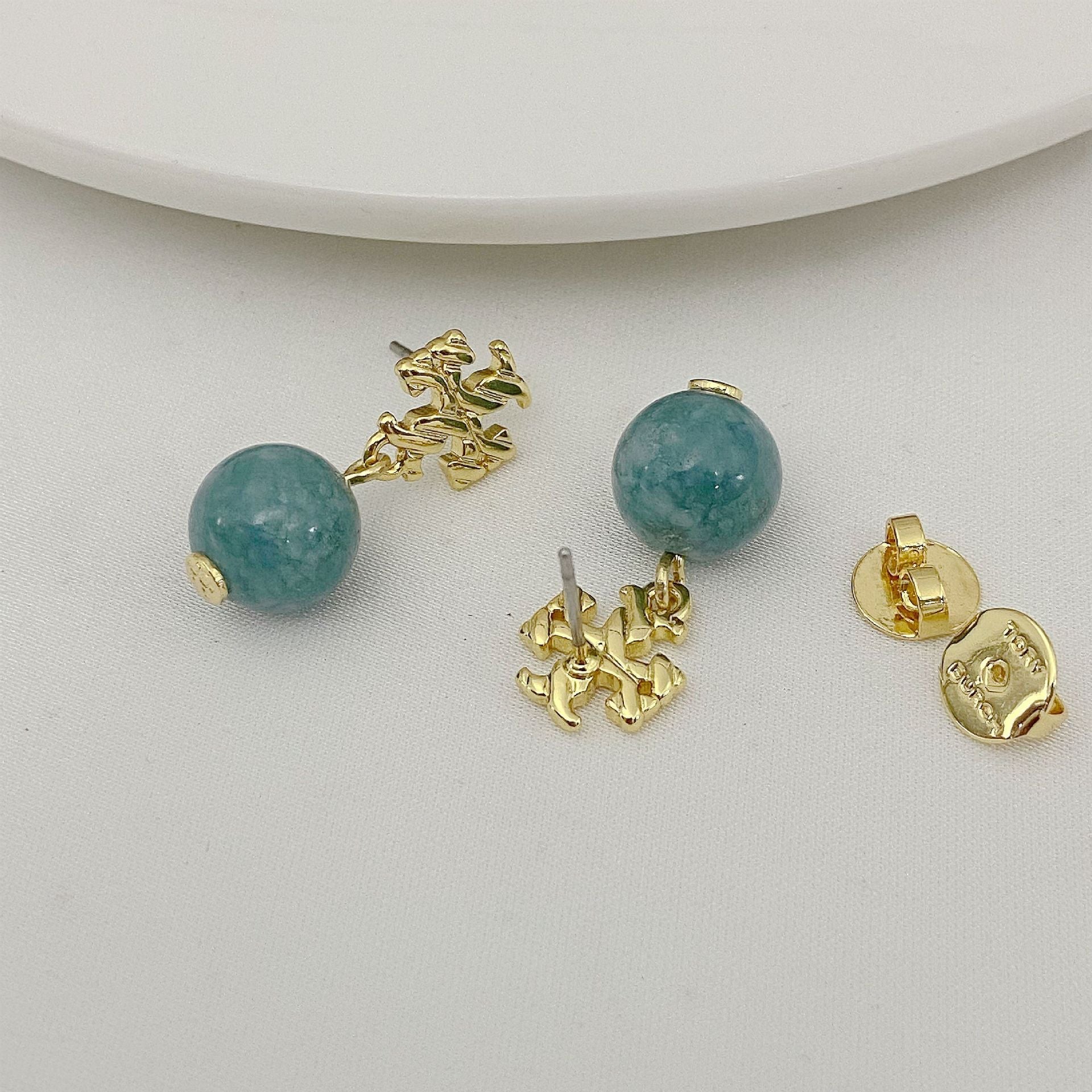 Agate pendant earrings with round teal-green beads and gold-toned textured settings