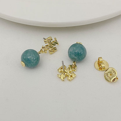 Agate pendant earrings with round teal-green beads and gold-toned textured settings