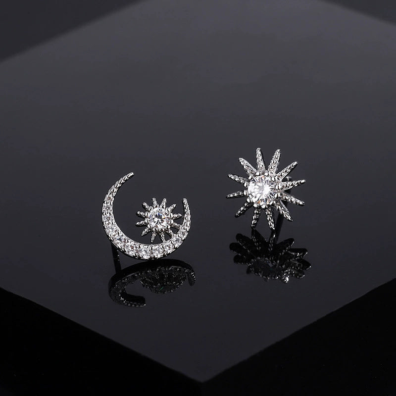 Moon and star diamond stud earrings, silver-tone crescent with starburst details