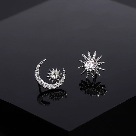Moon and star diamond stud earrings, silver-tone crescent with starburst details