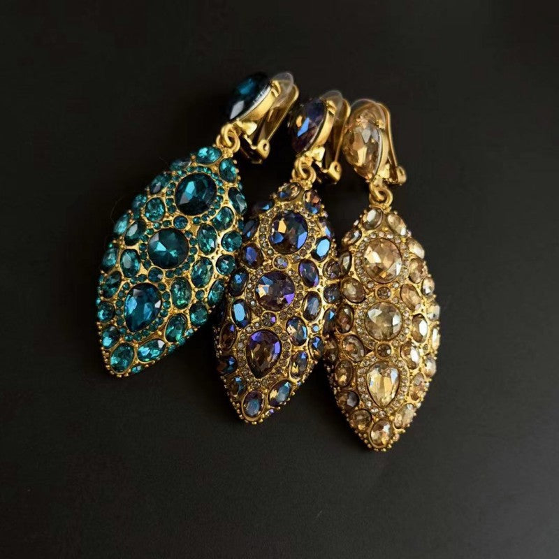 Blue and clear clip-on teardrop earrings with oval faceted crystal clusters