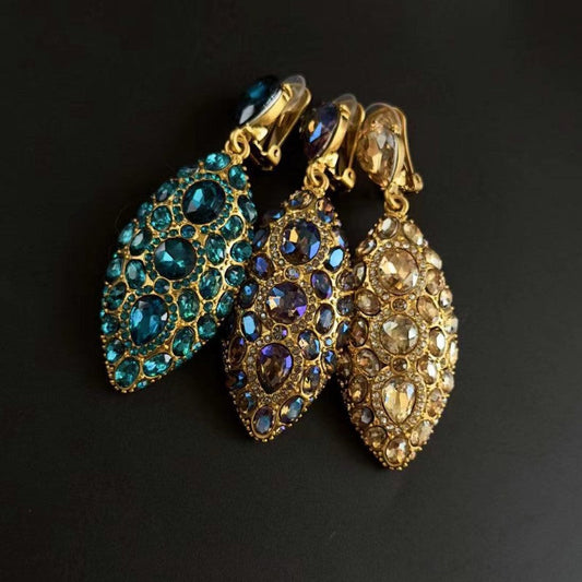 Blue and clear clip-on teardrop earrings with oval faceted crystal clusters