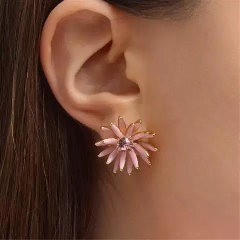 Enamel flower and pineapple diamond earrings with pink flower tops and gold textured drops.