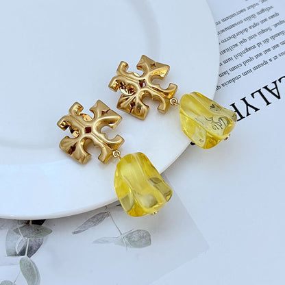 Gold-tone logo pendant earrings with yellow acrylic drop charms