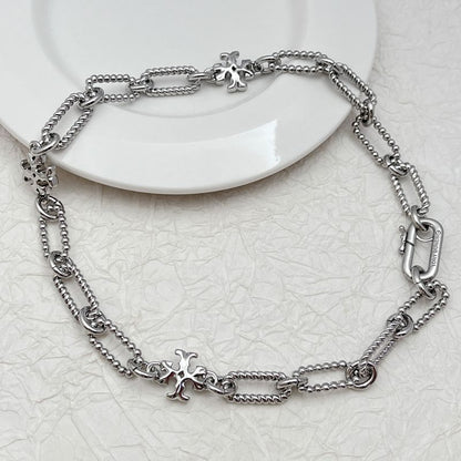 Silver square chunky chain logo bracelet with star-shaped emblem charm and carabiner clasp