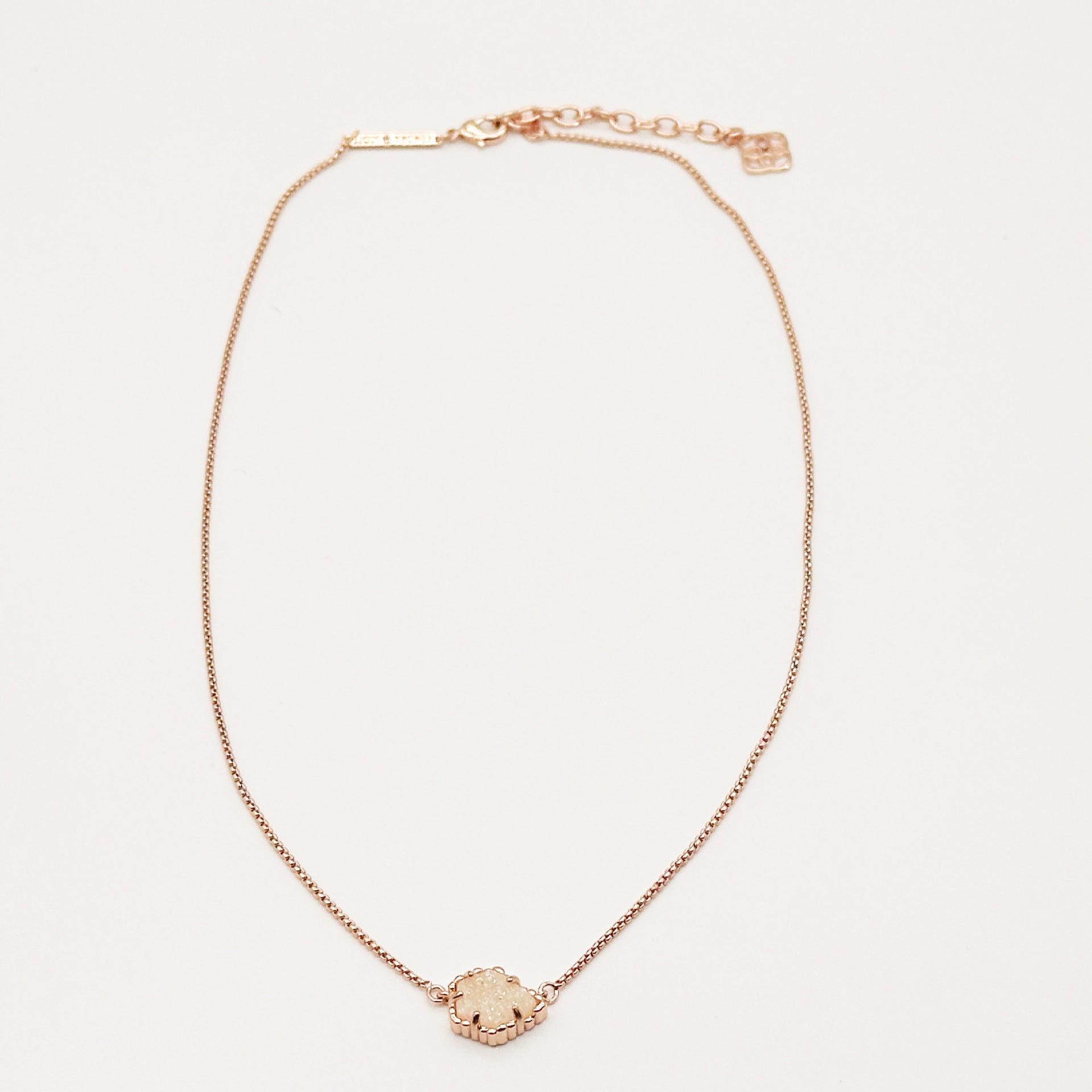 Kendra Scott rose gold-tone mother-of-pearl necklace with scalloped irregular rhombus pendant