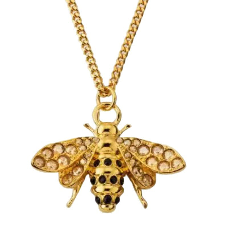 Gold bee pendant necklace with diamond-like embellishment, linked chain and clasp loop