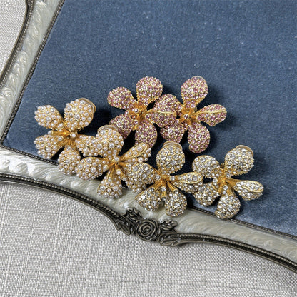 Five-petal flower clip-on earrings with white pearls and clear crystals on gold-tone setting