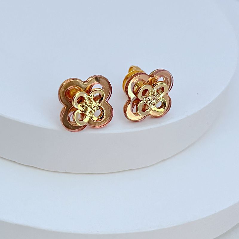 Rose-gold openwork clover flower stud earrings with gold-tone center filigree