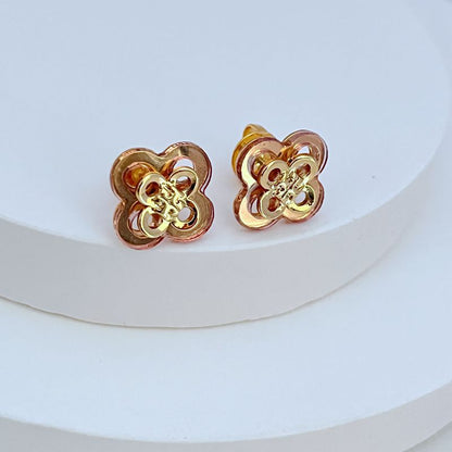 Rose-gold openwork clover flower stud earrings with gold-tone center filigree