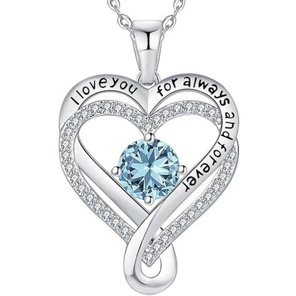 Silver heart pendant necklace with light blue round gemstone and pave heart frame