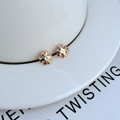 Sweet logo metal stud earrings, rose gold-tone and gold-tone interlocking emblem