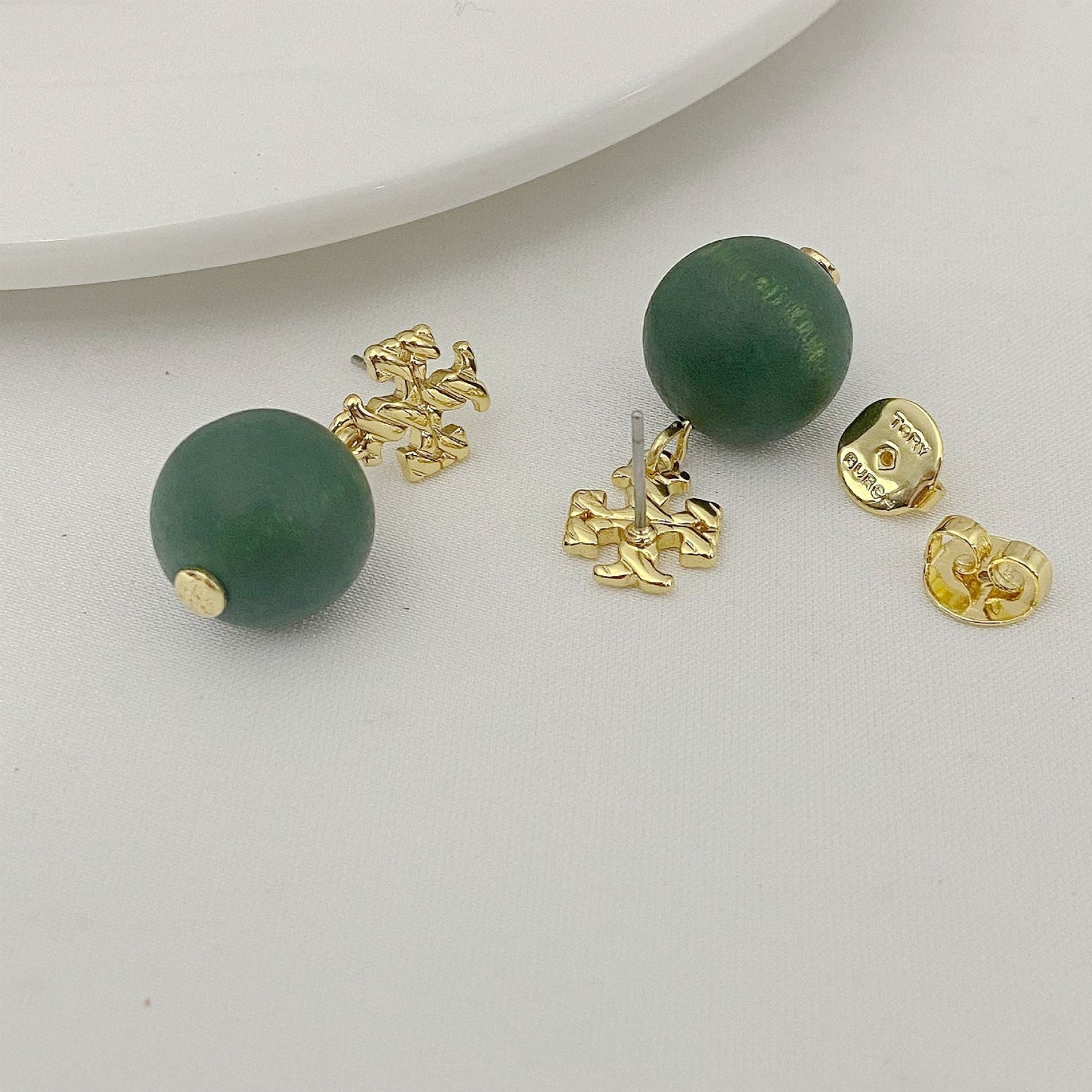 Tory Burch logo beaded pendant earrings, green round beads with gold tone logo caps