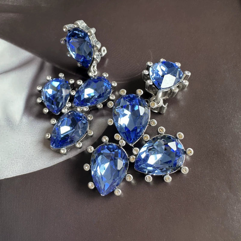 Cactus-cut glass ear clips with sapphire-blue stones and silver-tone prong setting