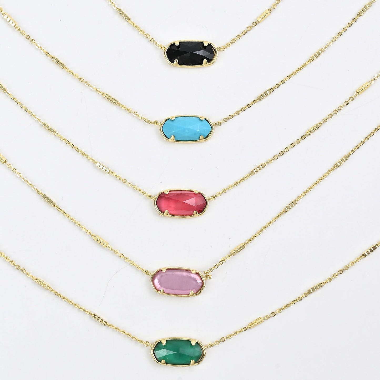 Kendra Scott oval crystal necklace set with gold chains and mixed oval stones