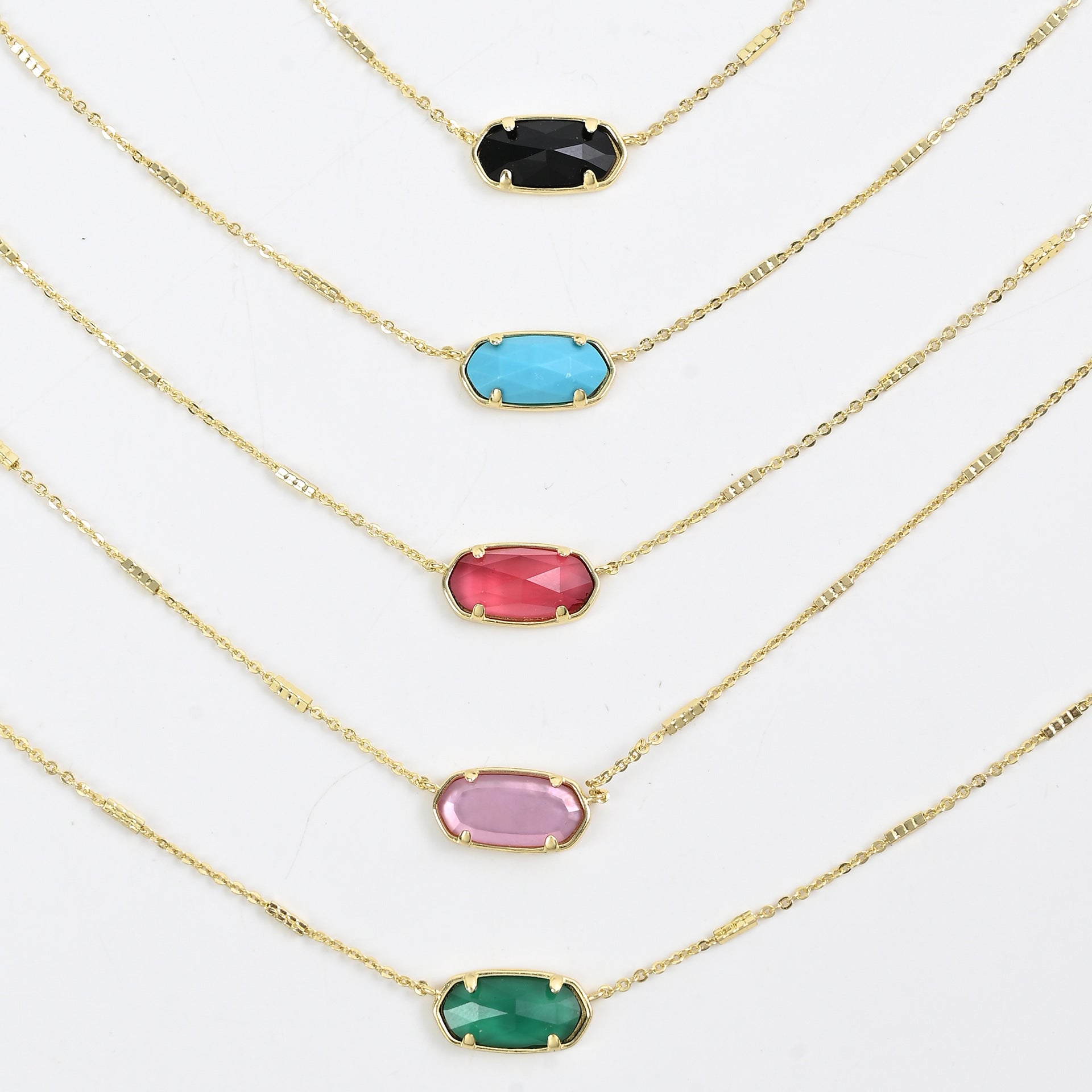 Kendra Scott oval crystal necklace set with gold chains and mixed oval stones