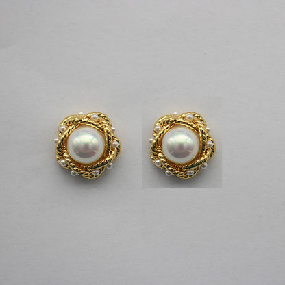 Gold-tone round pearl stud earrings with braided halo and white-luster center pearl