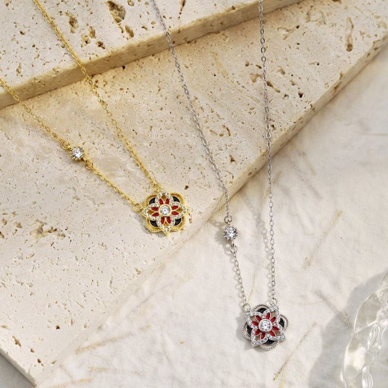 Contemporary Silver Flower Pendant with Clear, Red, and Black Accents


