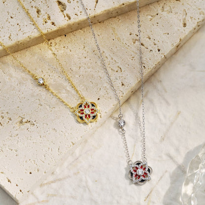 Contemporary Silver Flower Pendant with Clear, Red, and Black Accents

