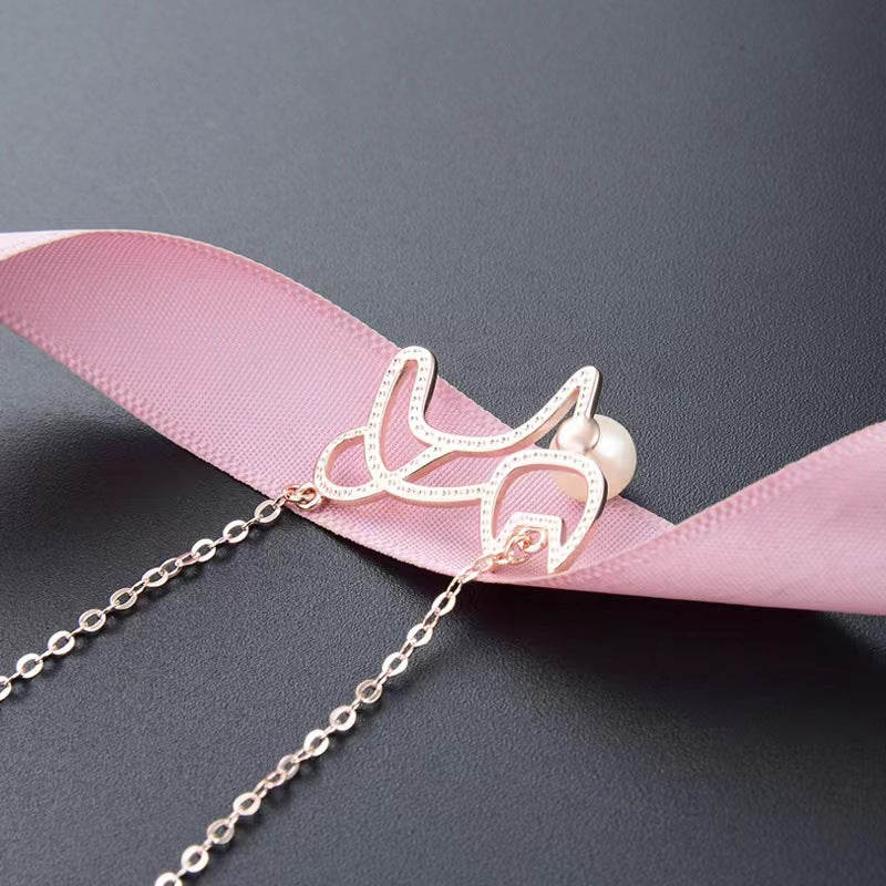 cat with pearl necklace
