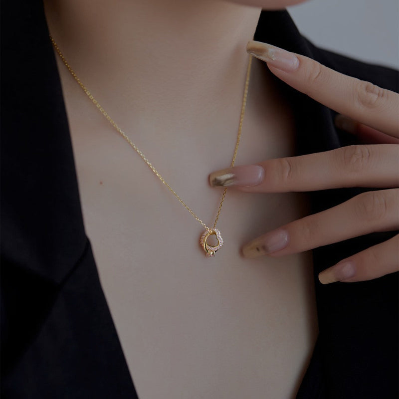 Elegant Gold Interlocking Hoop Necklace with Pink Gemstones

