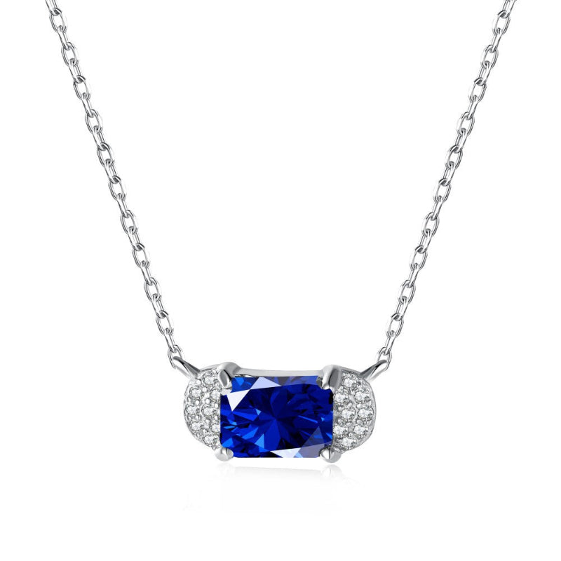 Elegant Silver Emerald Cut Blue Stone with Half-Moon CZ Accents

