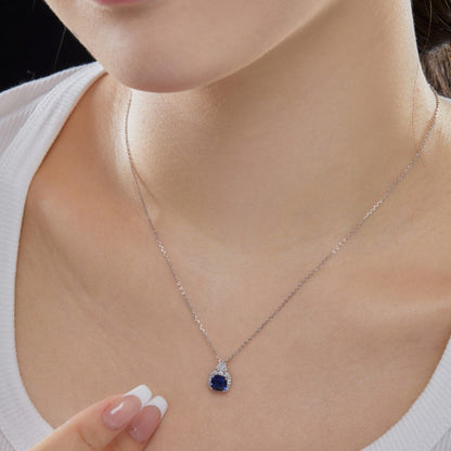 Elegant Silver Blue Crystal Halo Necklace with Baguettes

