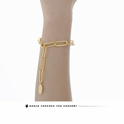 Trendy Gold Link Bracelet with Saint Charm

