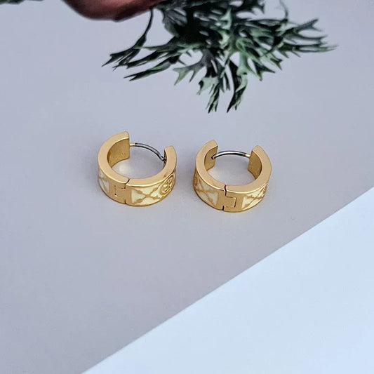 Gold hoop earrings with light marble enamel finish