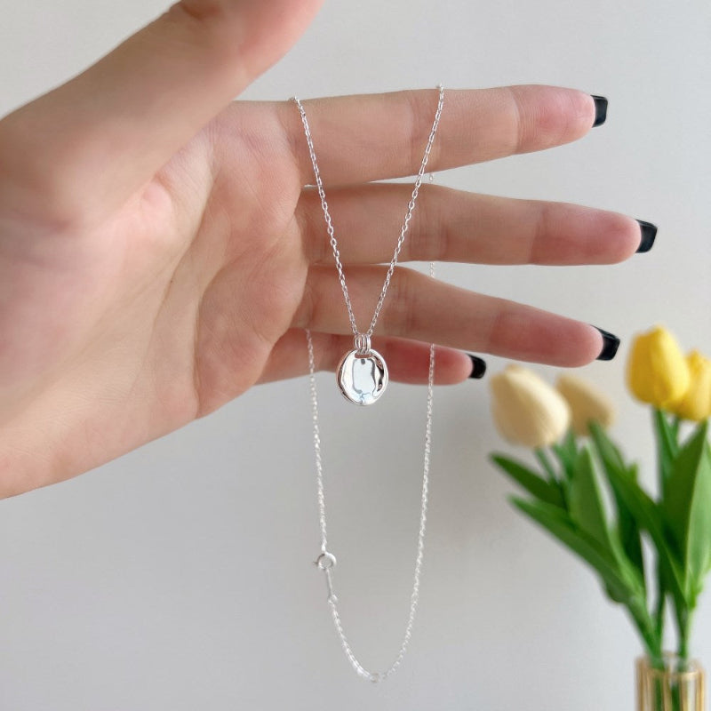 Dangling Silver Coin Pendant


