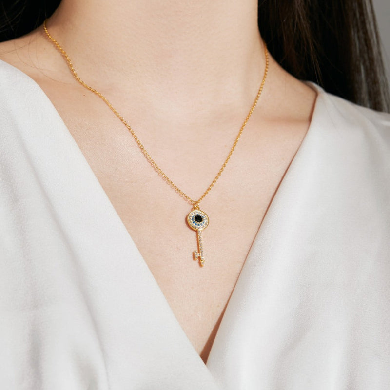Delicate Key Charm with Sparkling Evil Eye Details

