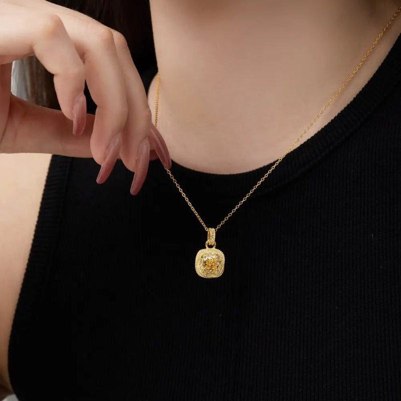 Brilliant Yellow Gemstone on a Gold Chain

