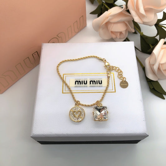 Miu Miu gold-tone necklace with round heart and square crystal pendant charms