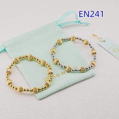 Two elastic bead bracelets, gold and gold-silver, with ridged oval and round beads