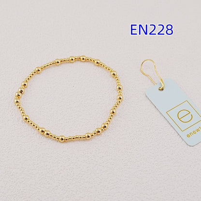 Gold beaded metal bracelet with round bead link design