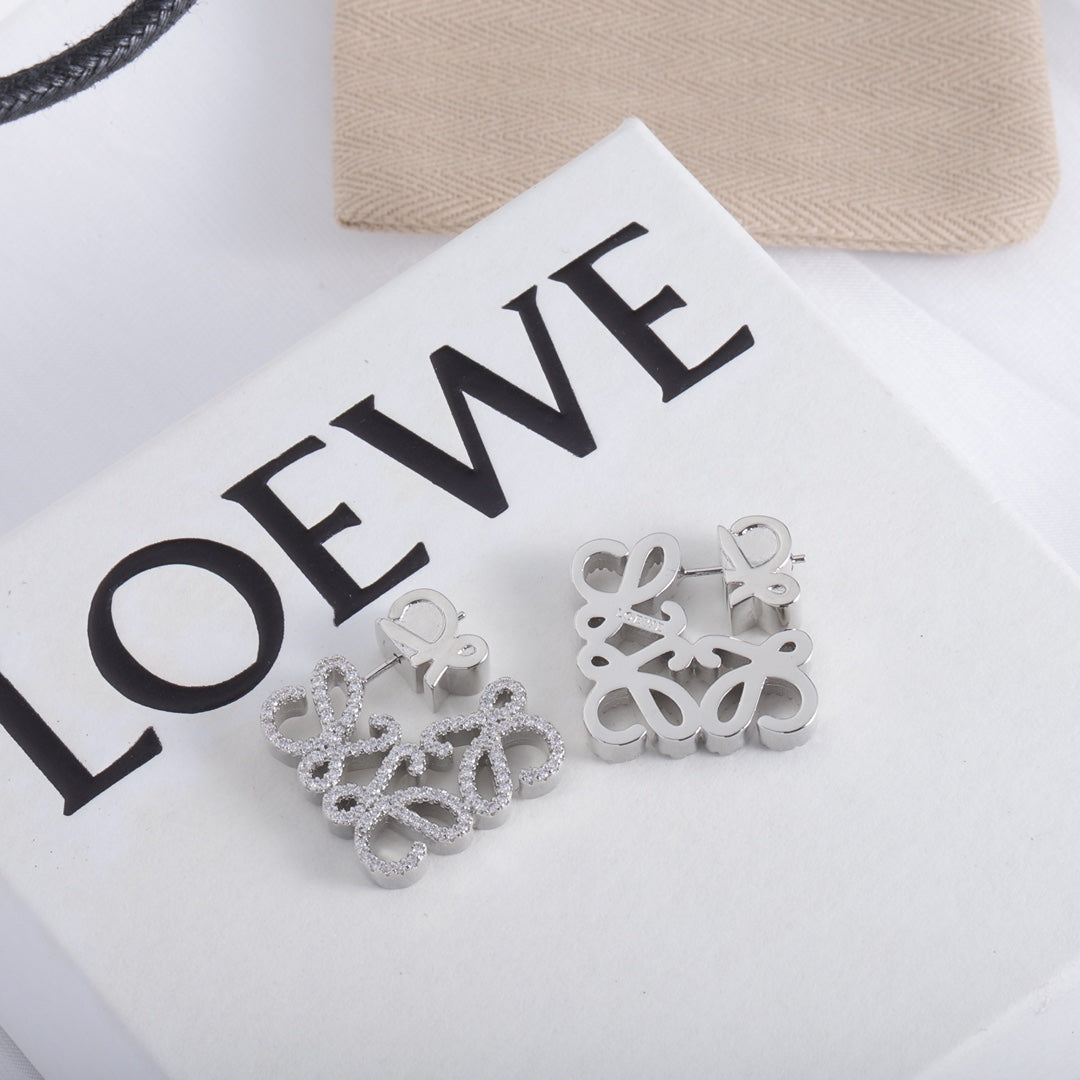 White gold geometric hollow diamond stud earrings, clustered floral shape on posts