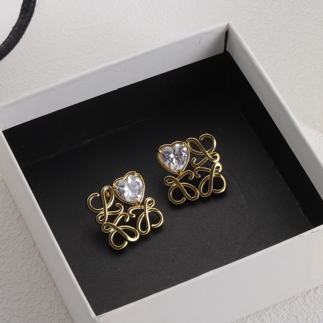 Gold-tone heart zircon earrings with clear stones in openwork square design
