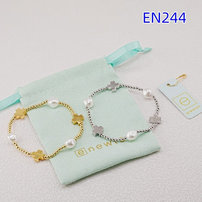 Pair of cross pearl beaded bracelets, gold and silver, with bar cross charms