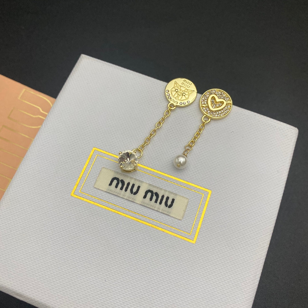 Gold asymmetrical diamond & pearl tassel earrings, heart and coin drop details